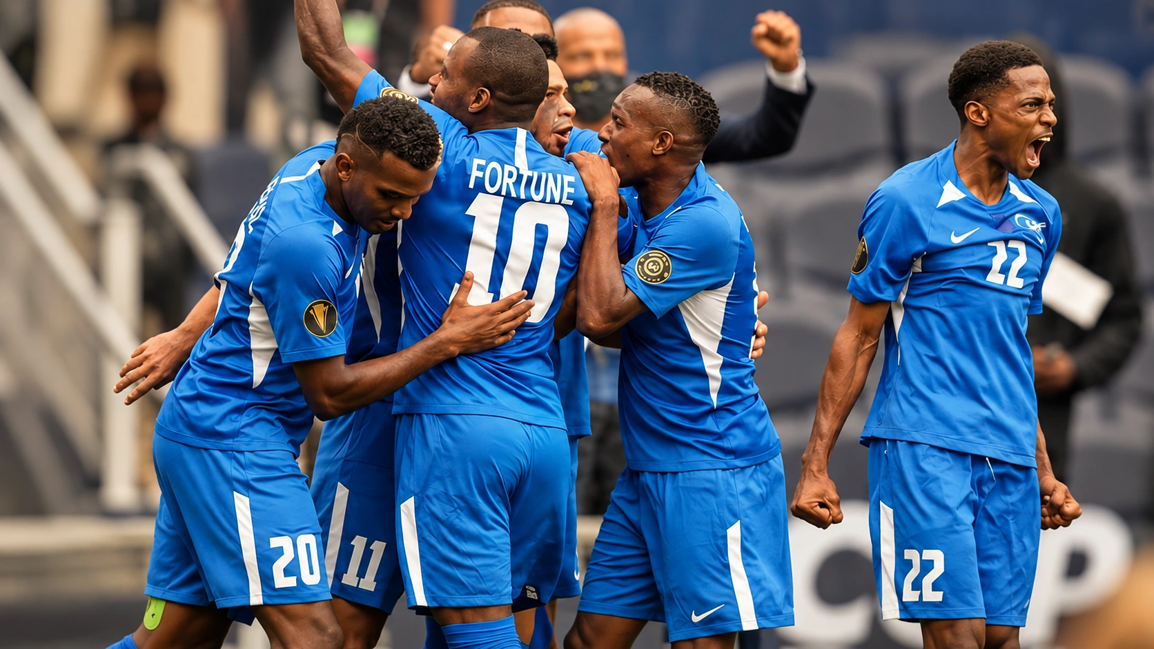 Football teammates celebrating together after a match